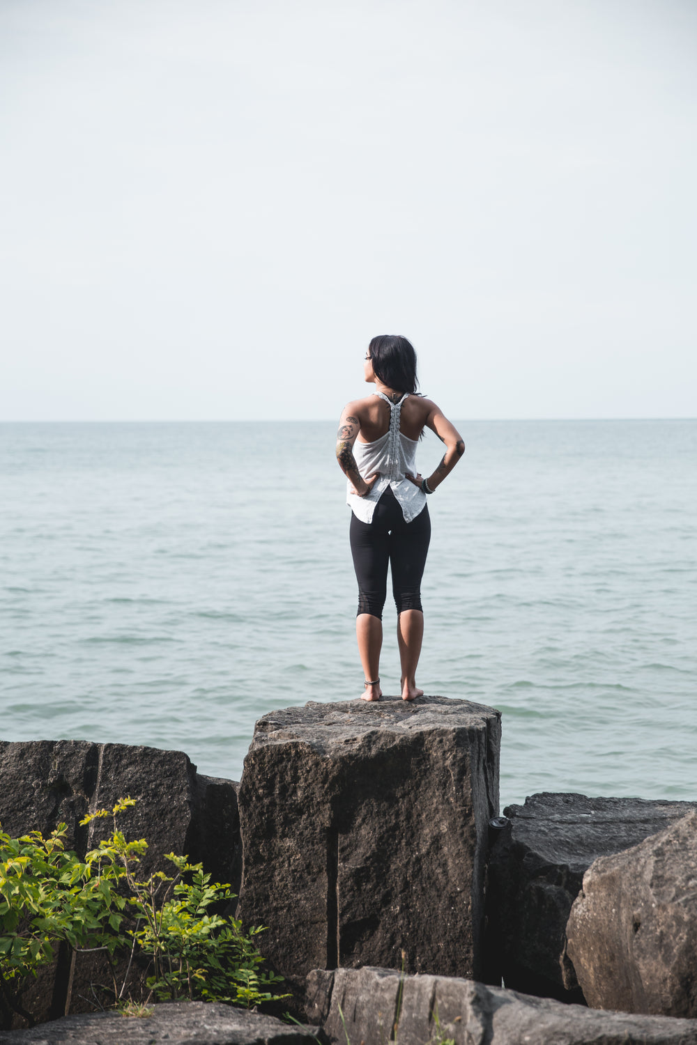 woman takes in ocean air