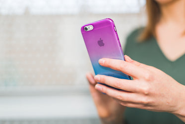 woman texting on gradient iphone