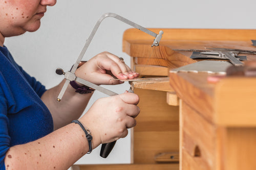woman using a coping saw