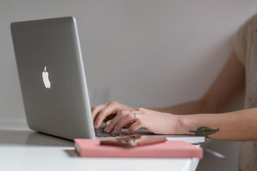 woman using macbook