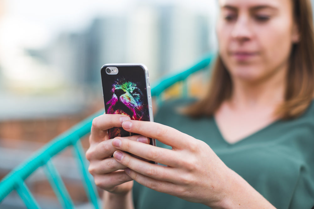 woman using smart phone with case