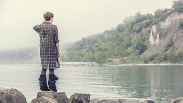 woman viewing rocky shoreline