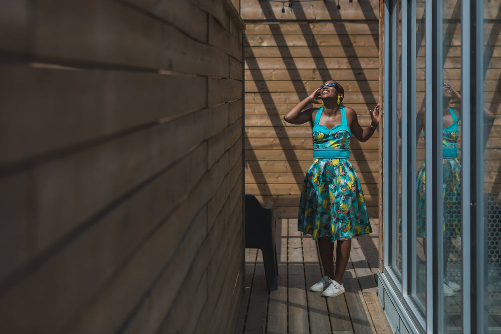 woman views eclipse from rooftop