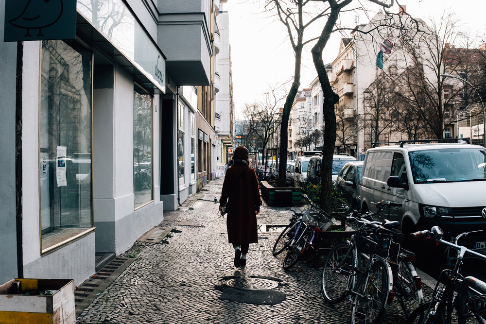 woman walks along the cobbled streets