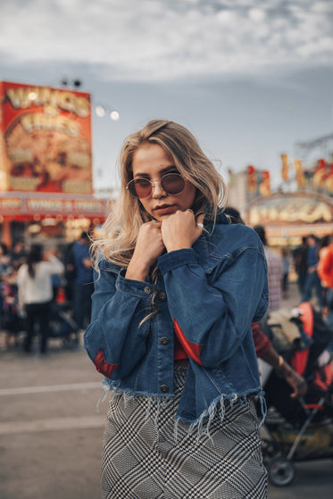 woman warms up in jean jacket