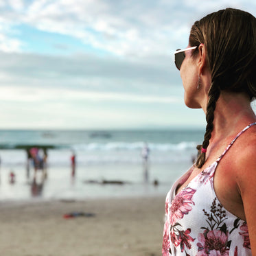 woman watches paddlers