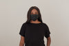woman wearing a black dispoable face mask