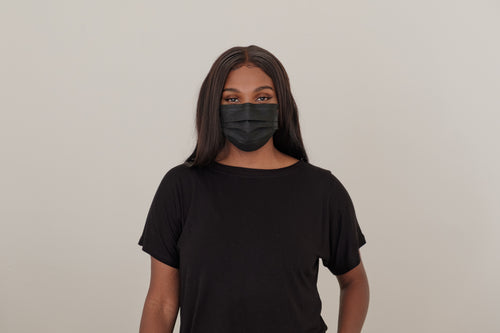 woman wearing a black dispoable face mask
