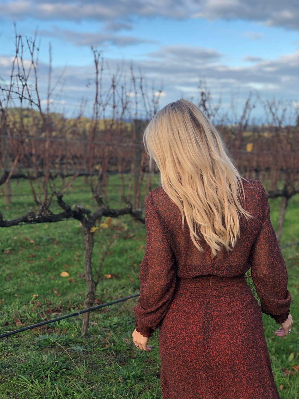 woman wearing red in a field