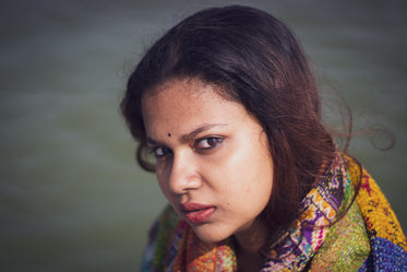 woman wears colorful scarf