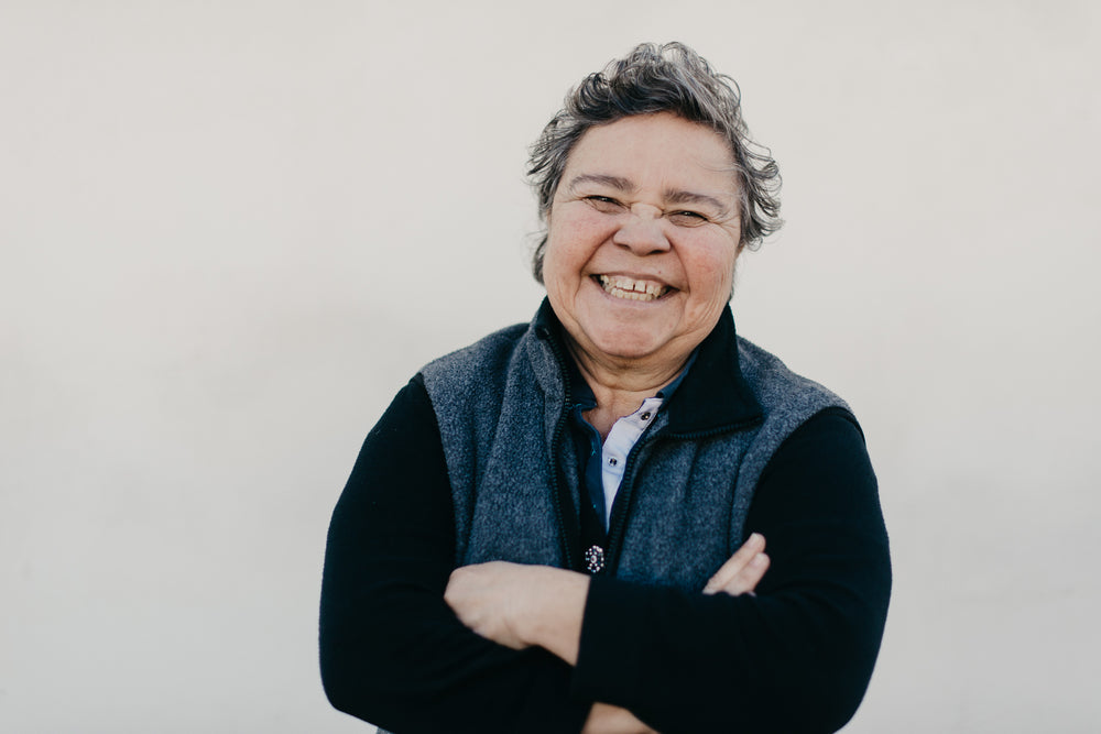 woman-with-arms-crossed-smiling