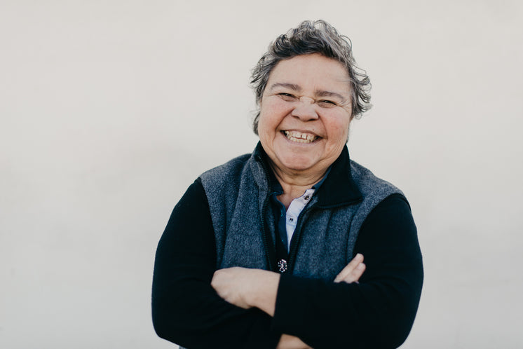 Woman With Arms Crossed Smiling