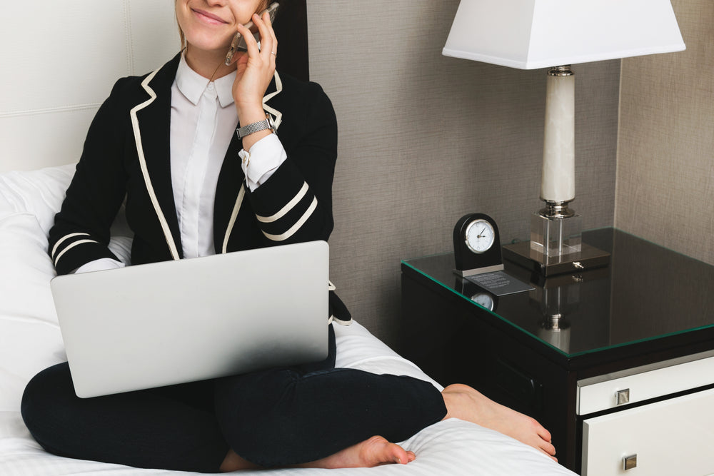 woman with laptop in hotel