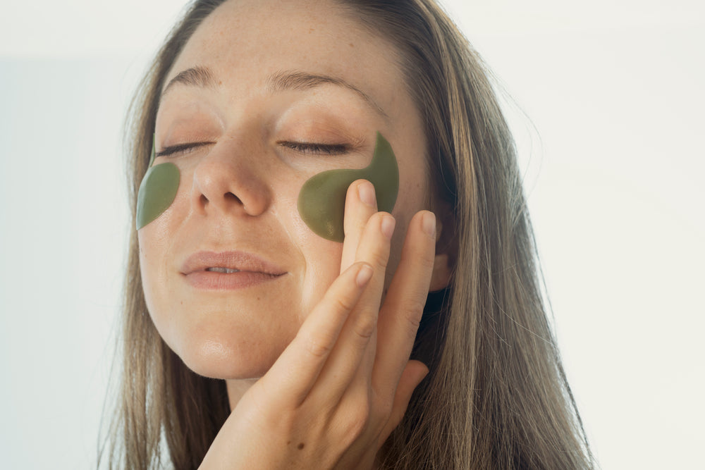 woman with under eyes cosmetic patches