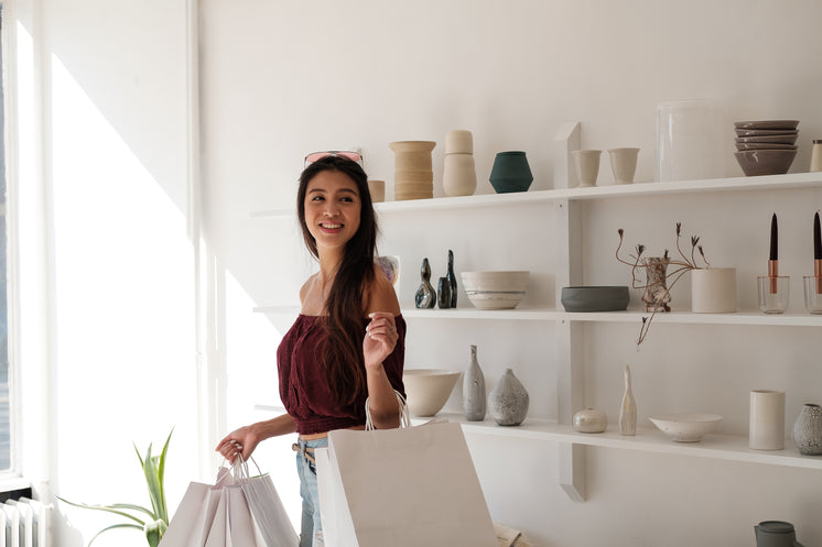 Woman With White Crisp Shopping Carrier Bags