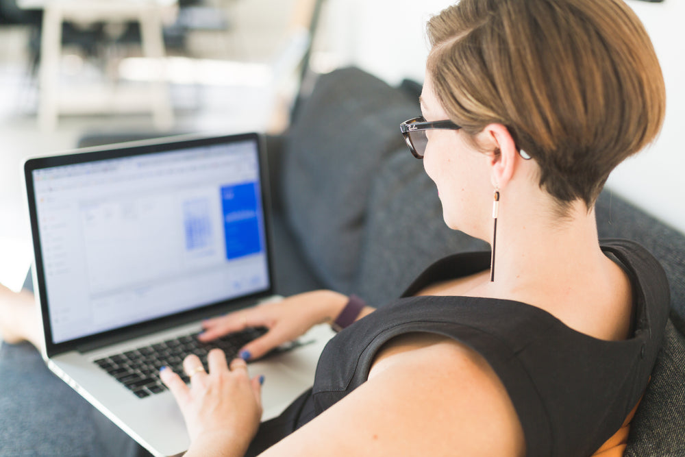 woman working on office sofa