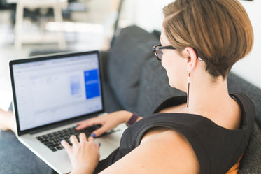 woman working on office sofa