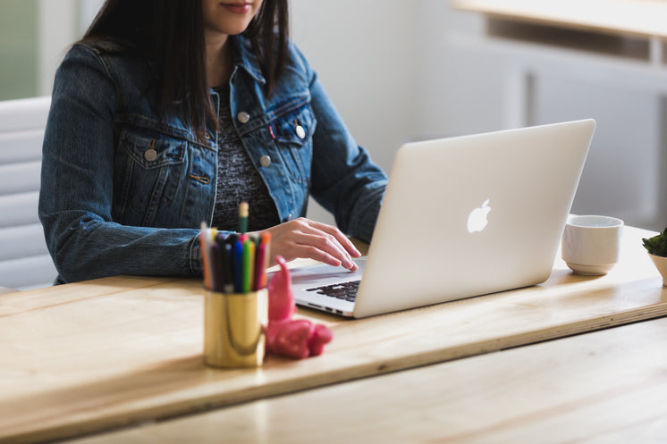 Woman Works At Desk