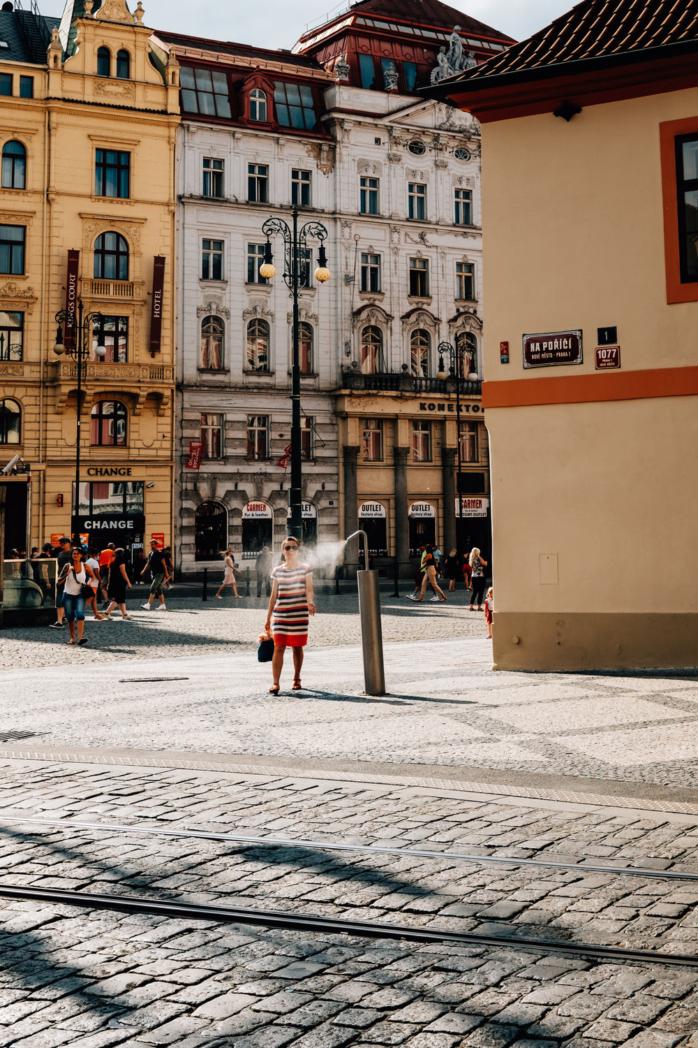 women in dress walks through mist