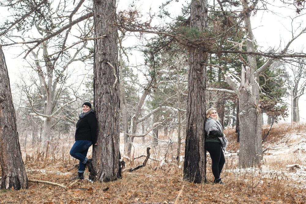 women standing against trees