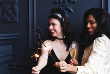women with sparklers and champagne