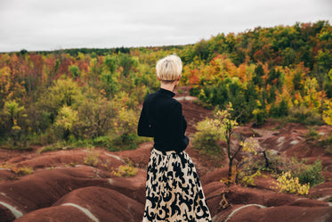 womens fall fashion skirt in autumn landscape