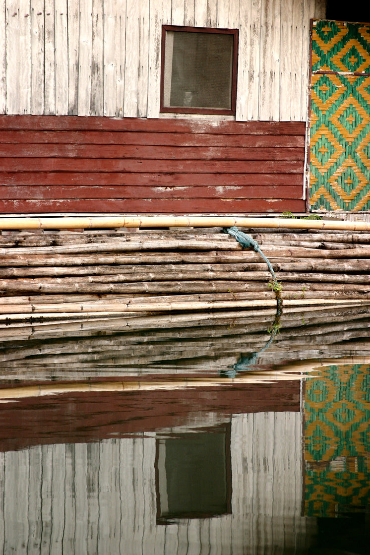 wood-wall-and-bamboo-bundle-reflection.j