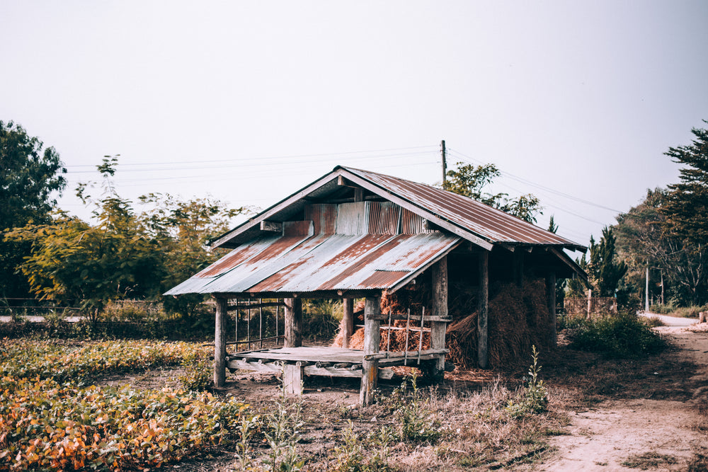 wooden and metal hay barn