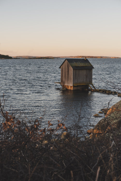 wooden cabin on a lake