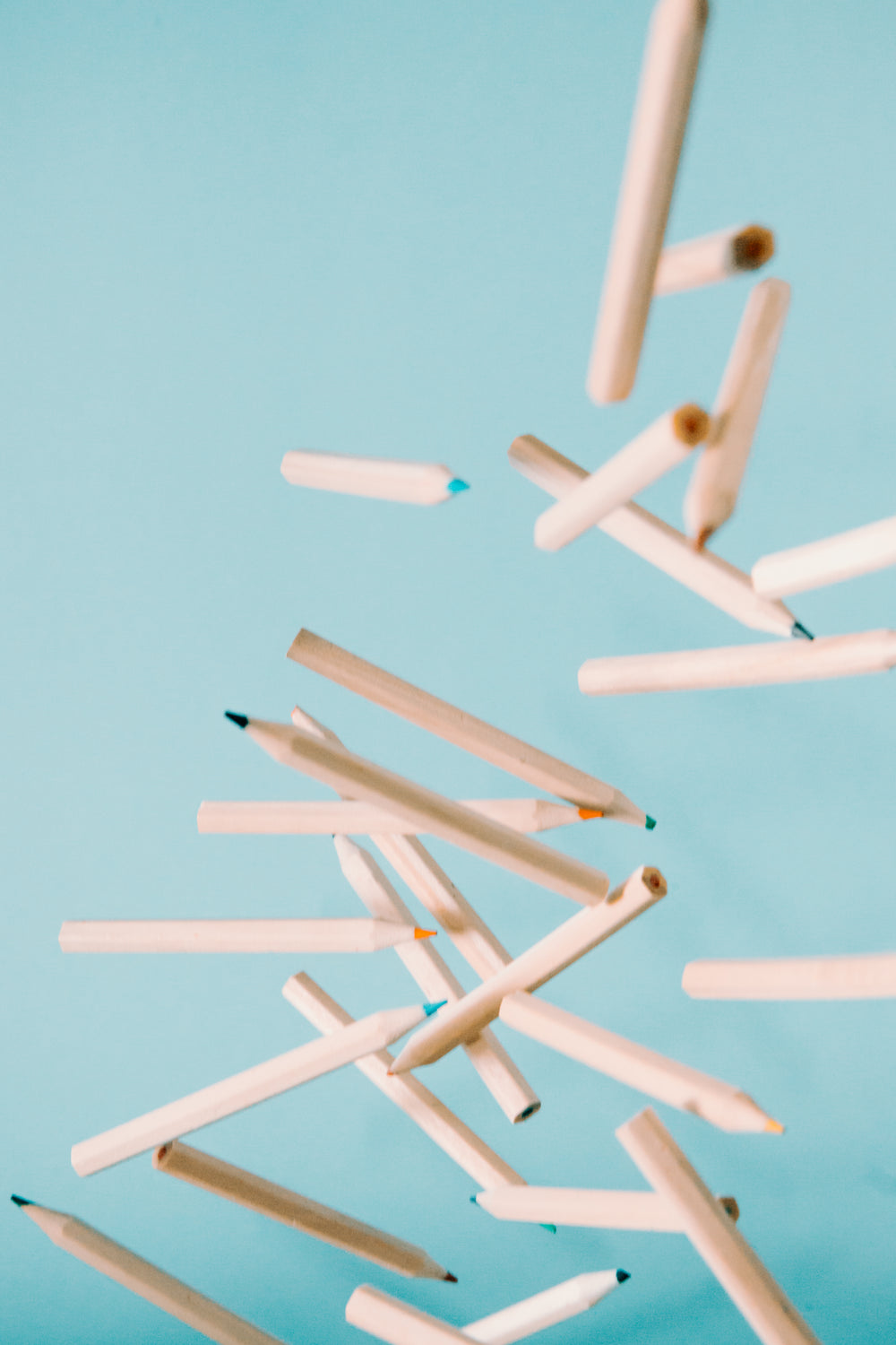 wooden coloring pencils fly through the air