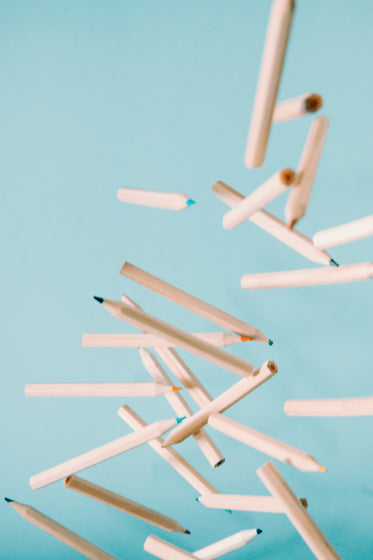 wooden coloring pencils fly through the air