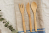 wooden cutlery on linen