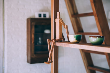 wooden figure on a shelf