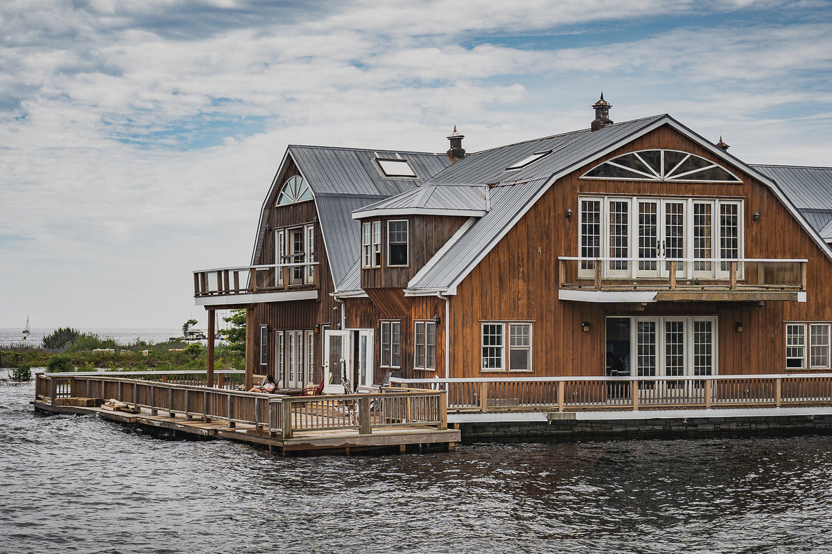 wooden house at waters edge