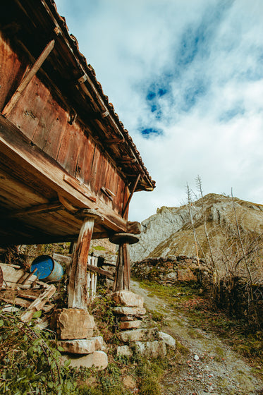 wooden hut on mountain side
