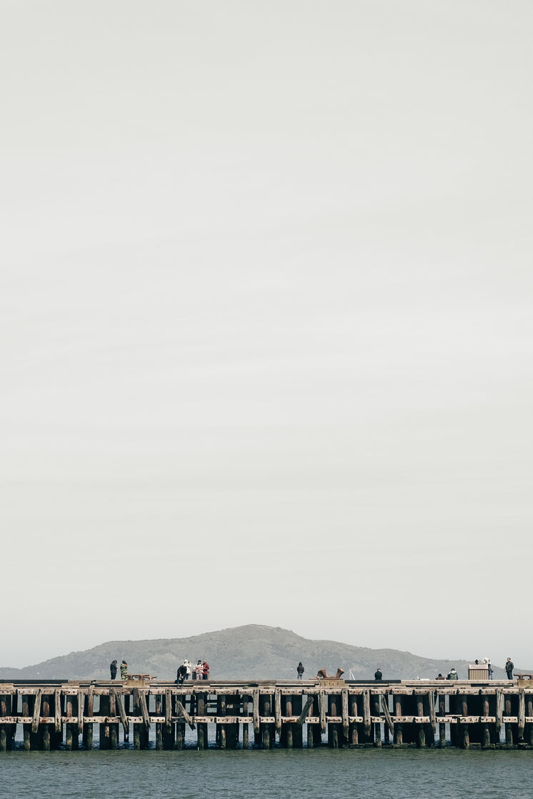 Wooden Pier Under Grey Sky