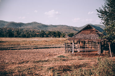 wooden shed in large field