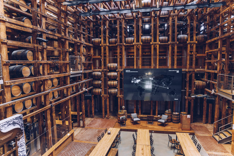 wooden-structure-hall-with-long-tables.j