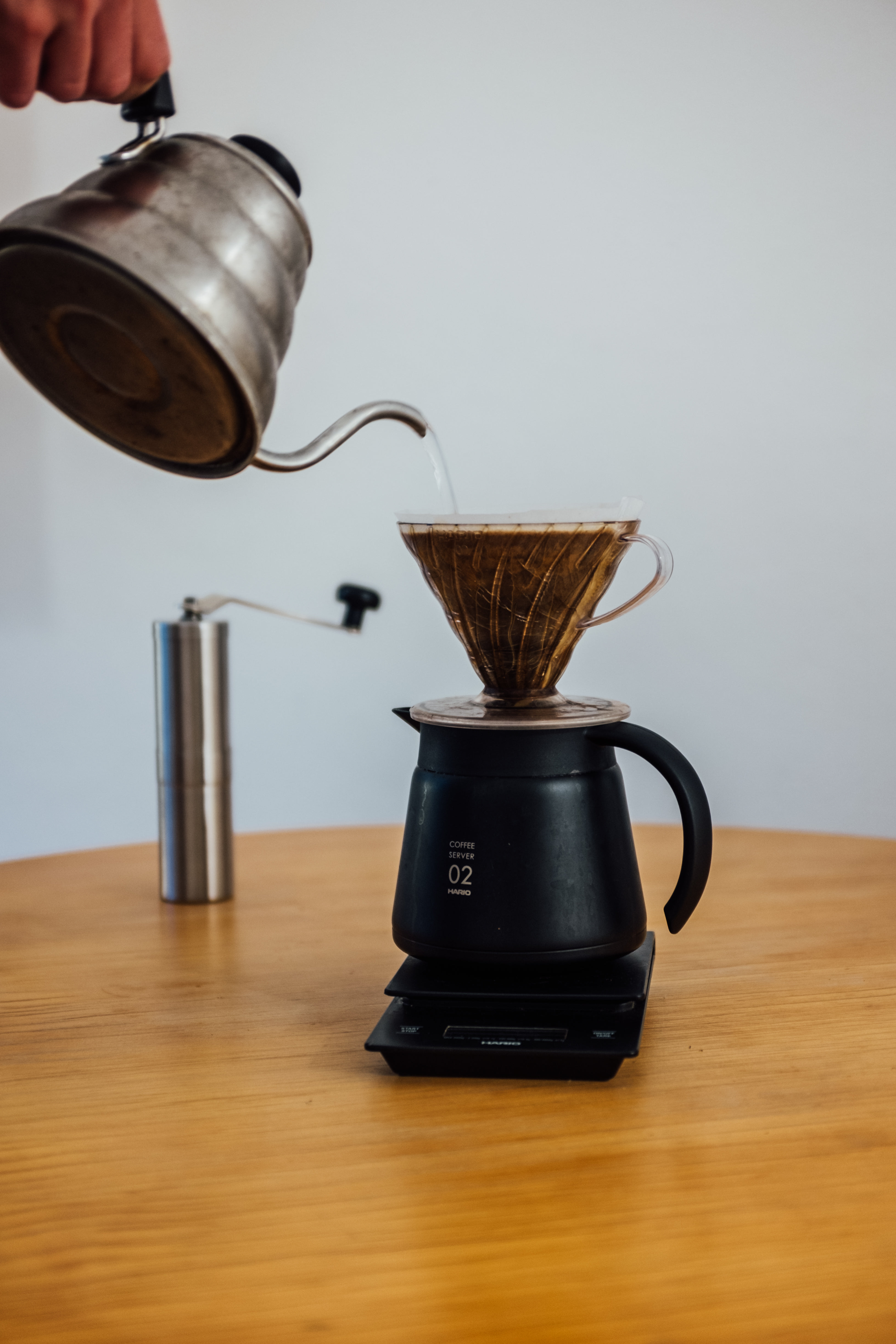 wooden-table-with-a-scale-and-pour-over-coffee