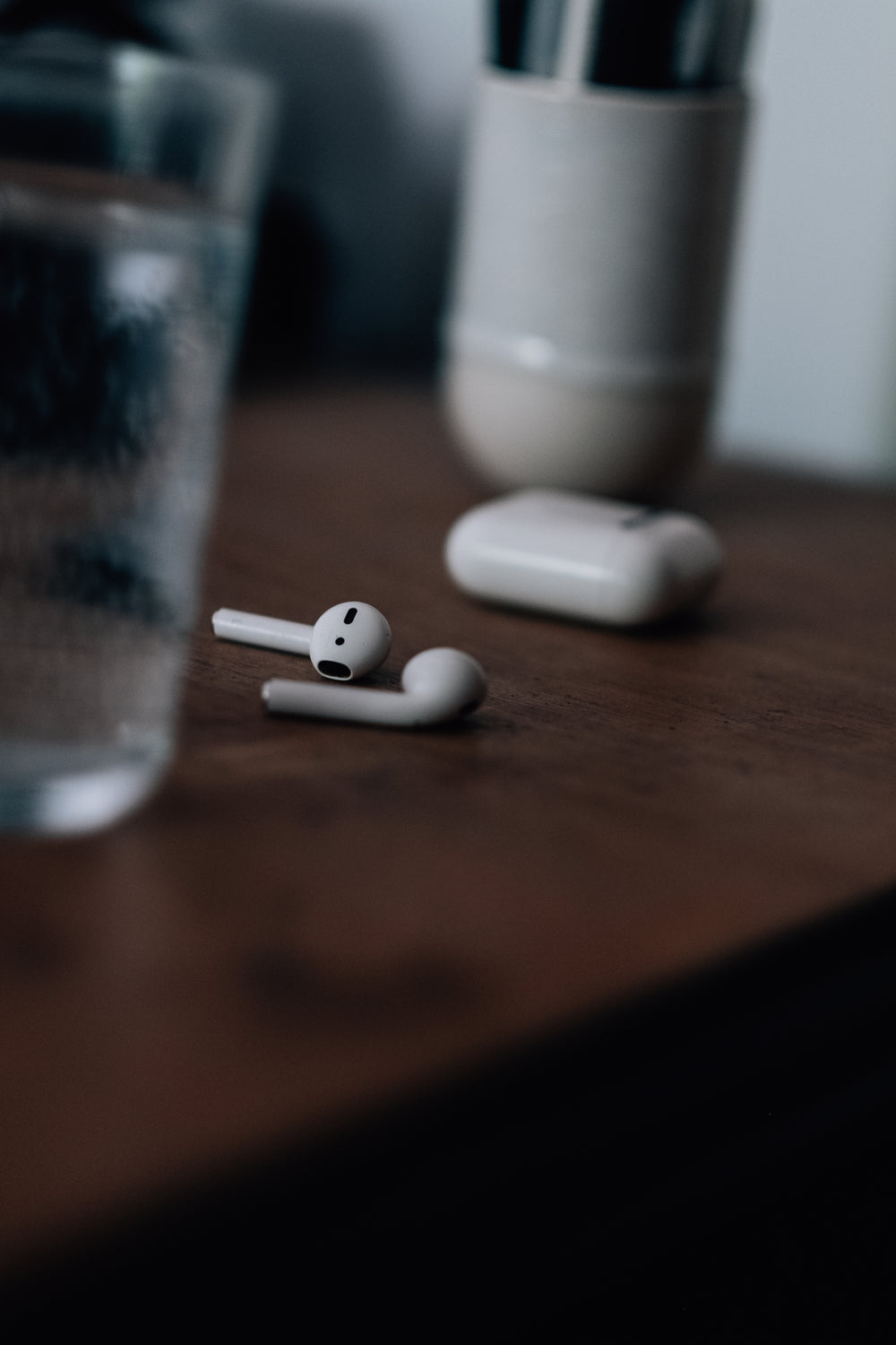 wooden table with wireless earphones