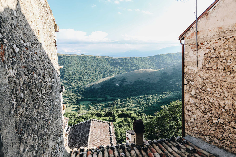 worn houses frame natural landscape