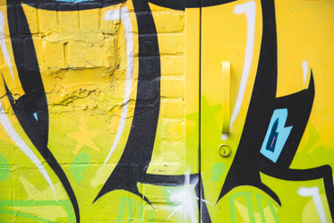 yellow black spray painted wall