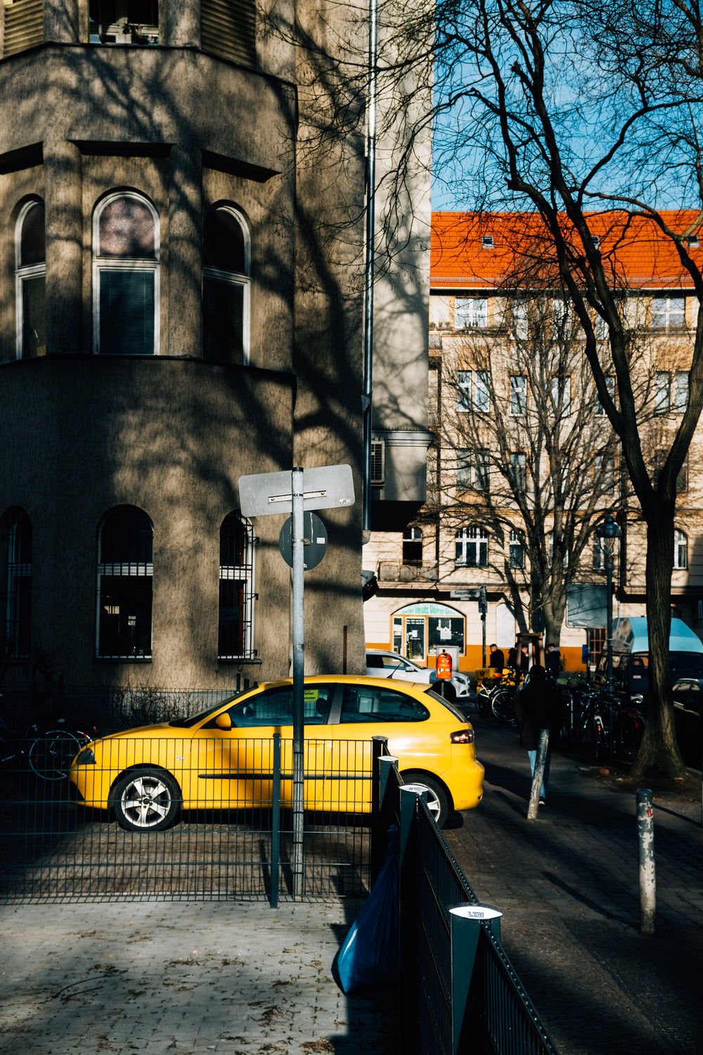 yellow car on city street