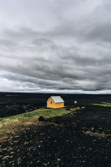 yellow house in the blank sands