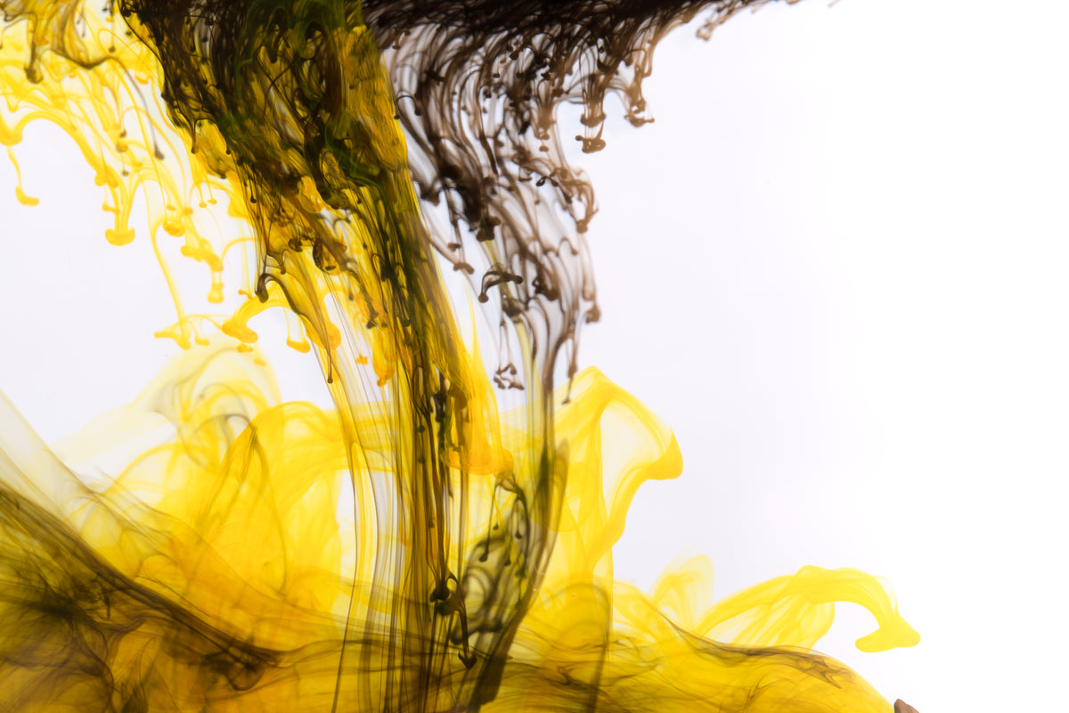 yellow ink with black drops