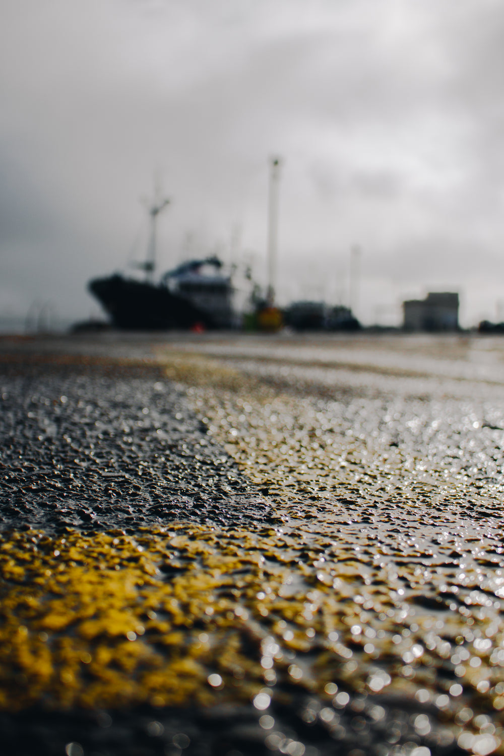 yellow paint on wet asphalt