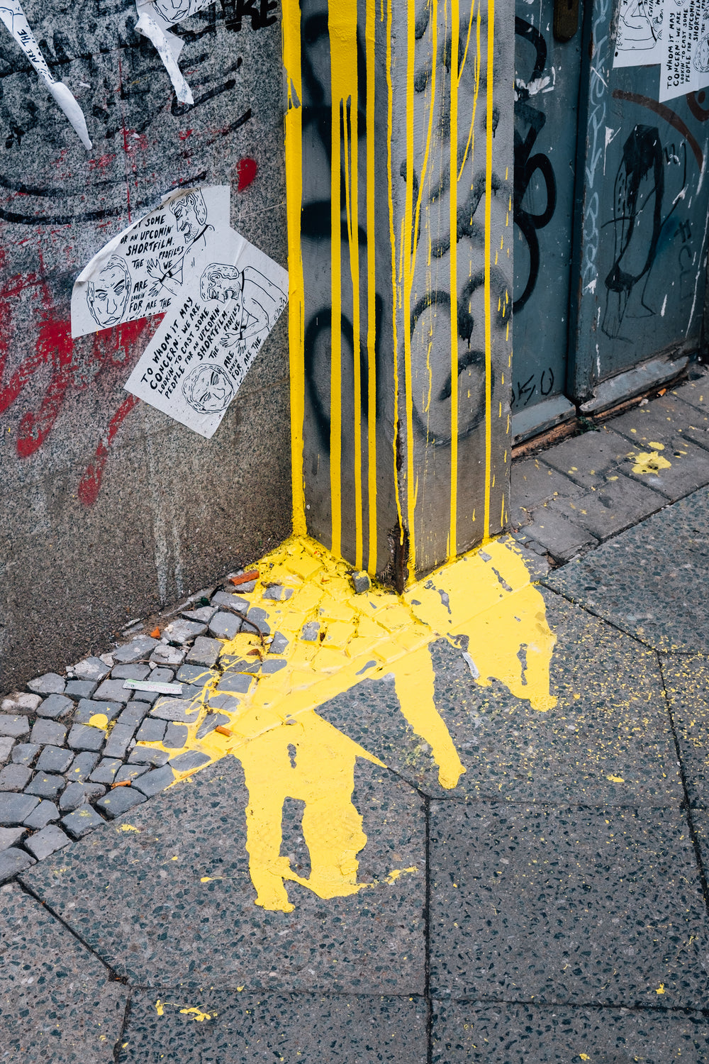 yellow paint runs down the wall