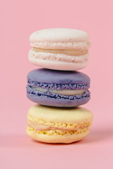 yellow purple and cream macarons