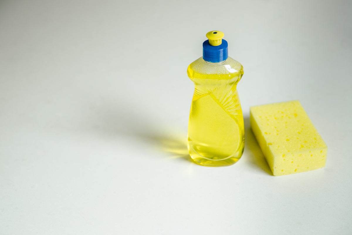 yellow sponge and cleaning soap