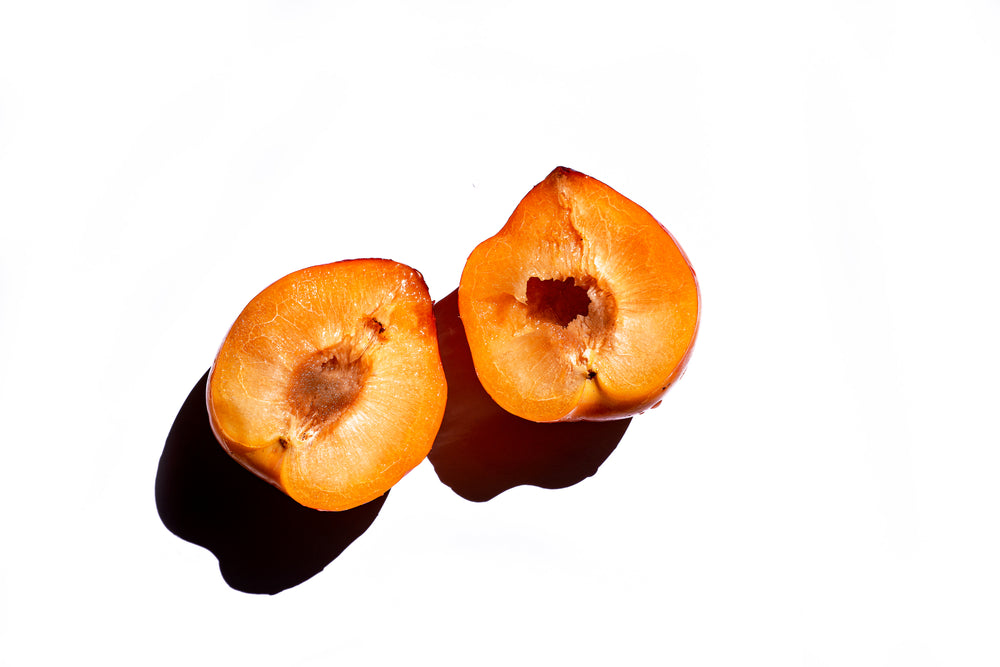 yellow stone fruit on a white background